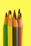 bunch of colorful pencils on yellow