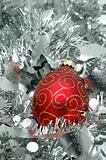 Christmas ball over silver garland