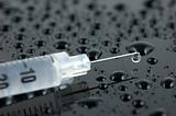 Syringe with droplets