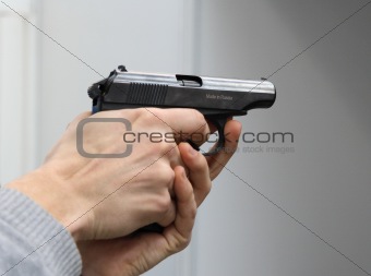Gun in a man\'s hands