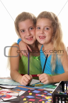 shot of sisters coloring together vertical