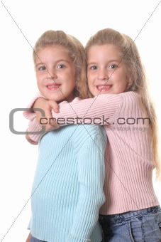 shot of happy sisters hug vertical on white