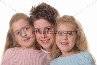 shot of brother with twin sisters headshot