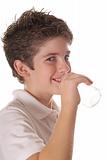 shot of a young boy drinking water vertical