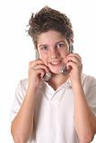 shot of a young boy on two cell phone vertical