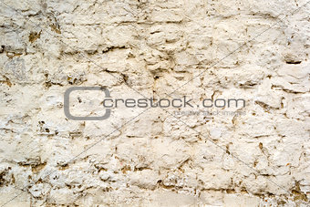 Background of old cracked painted brick wall with cement