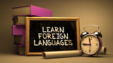 Learn Foreign Languages Handwritten on Chalkboard.