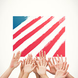 Composite image of people raising hands in the air