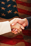 Composite image of close up on partners shaking hands