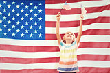 Composite image of cute boy with american flag