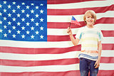 Composite image of cute boy with american flag