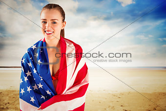 Composite image of pretty girl in bikini with american flag