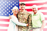 Composite image of soldier reunited with parents