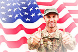 Composite image of soldier showing thumbs up