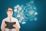 Composite image of geeky businessman reading from book