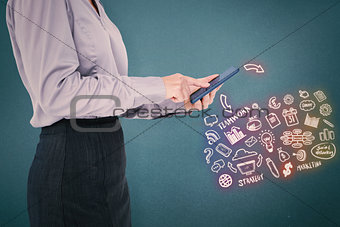 Composite image of businesswoman using her smartphone