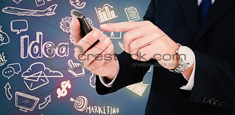 Composite image of businessman in glasses using his tablet pc