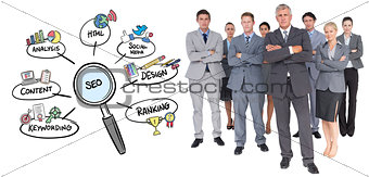 Composite image of business team standing arms crossed