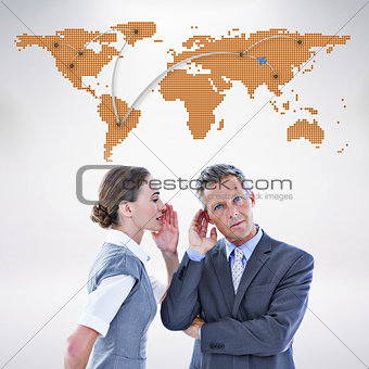 Composite image of gossiping business team