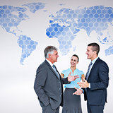 Composite image of business people standing and talking