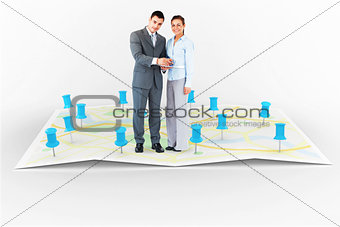Composite image of business partners with clipboard