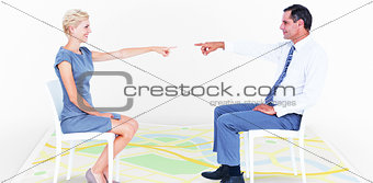 Composite image of business people pointing at each other