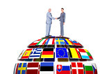 Composite image of businessman and woman shaking hands