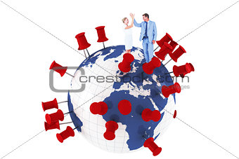 Composite image of businessman and businesswoman greeting each other