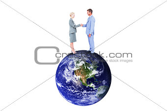 Composite image of  smiling business people shaking hands