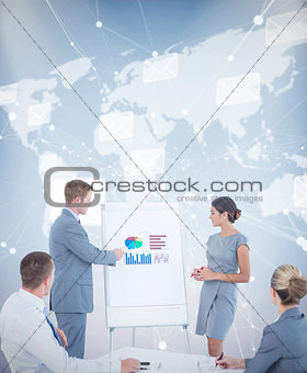 Composite image of manager presenting statistics to his colleagues