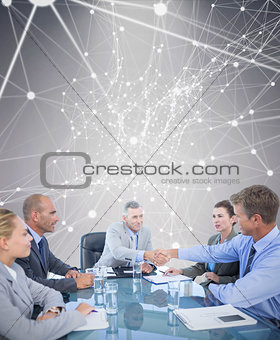 Composite image of business team during meeting