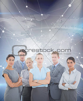 Composite image of business team smiling at camera