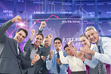 Composite image of business people cheering in office