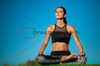 woman in lotus position
