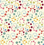 Seamless vector pattern, background or texture with colorful yellow, orange, pink, green and blue polka dots. 