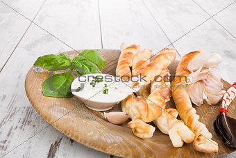 Pizza breadsticks with ingredients.