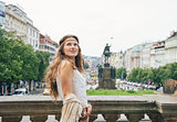 Happy bohemian woman tourist sightseeing in Prague