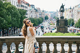 Hippy-looking woman tourist standing on Wenceslas Square, Prague