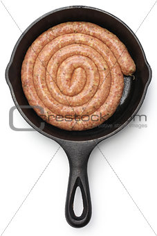 raw cumberland sausage, spiral pork sausage on skillet