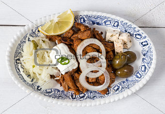 Gyros with Tzatziki Coleslaw olives and feta cheese