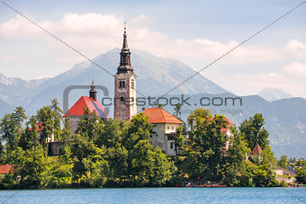 Island with Catholic Church on Bled Lake in Slovenia with Mounta