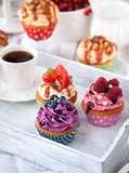 Different delicious cupcakes and coffee cup 
