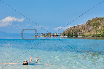 tourist sunbathing swimming Palawan Philippines