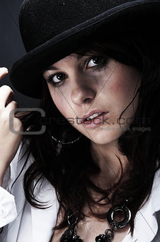 Beautiful young woman wearing black hat