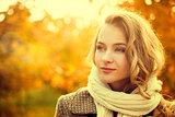 Portrait of Young Fashion Woman on Autumn Background