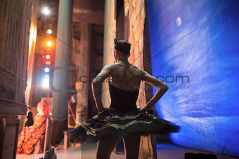 Prima ballerina standing backstage