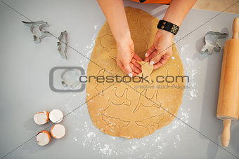 Woman making cookies for Halloween party. Closeup