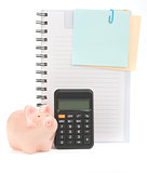 Copybook with piggy bank and calculator