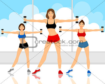Girls working out with dumbbells