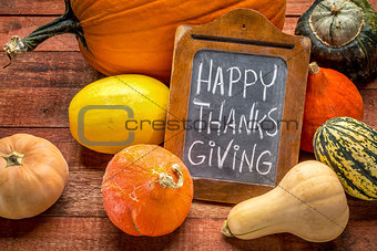 Happy Thanksgiving on blackboard with squash